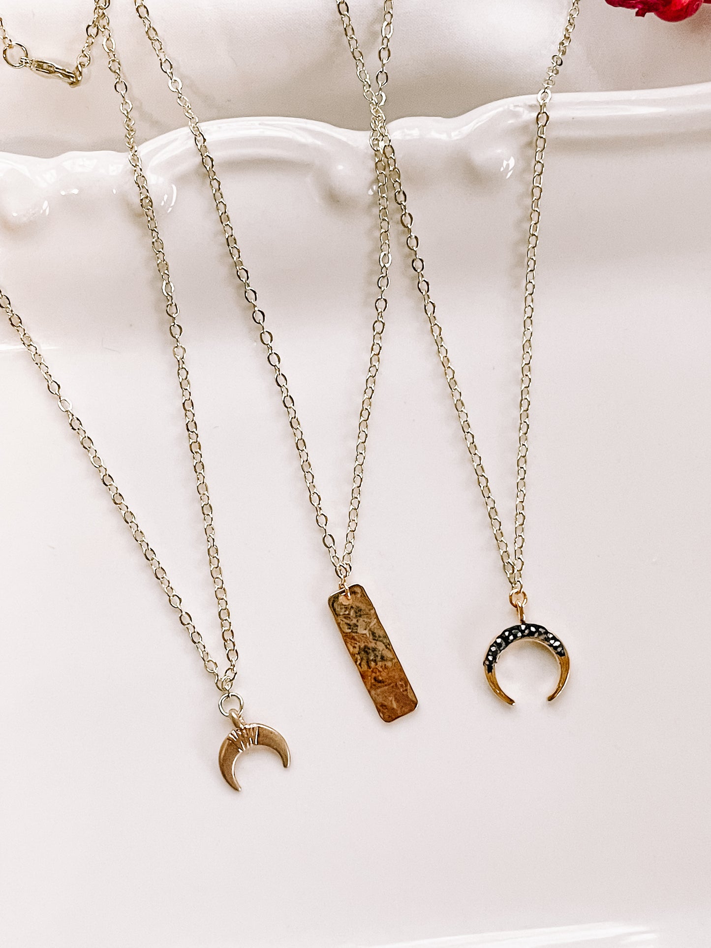 Mixed metals charm necklace