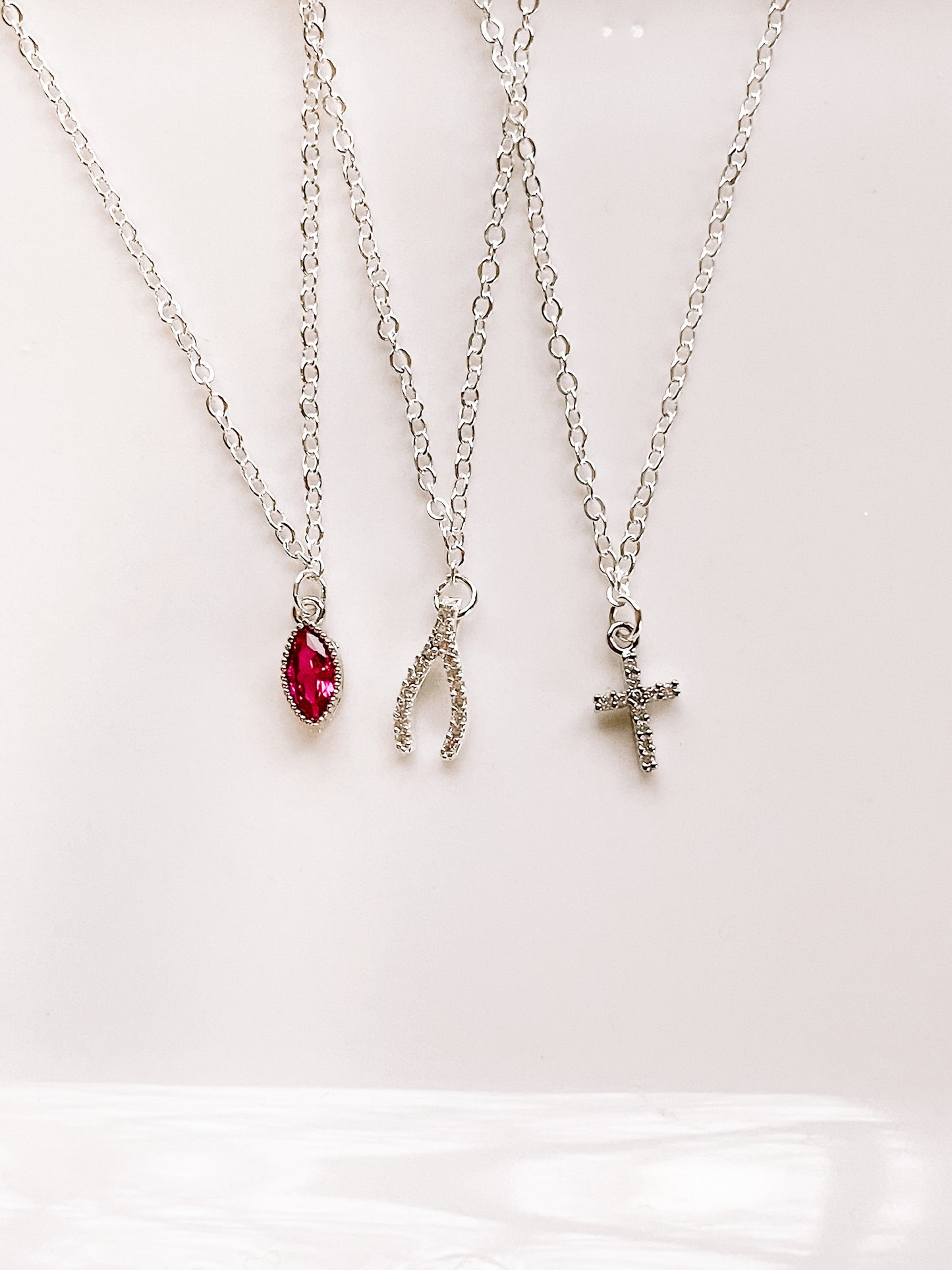Studded cross charm necklace